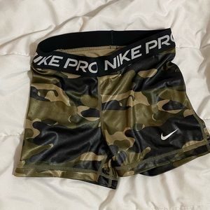 camo nike pros size xs… worn 1 time, no stains or holes or wear.